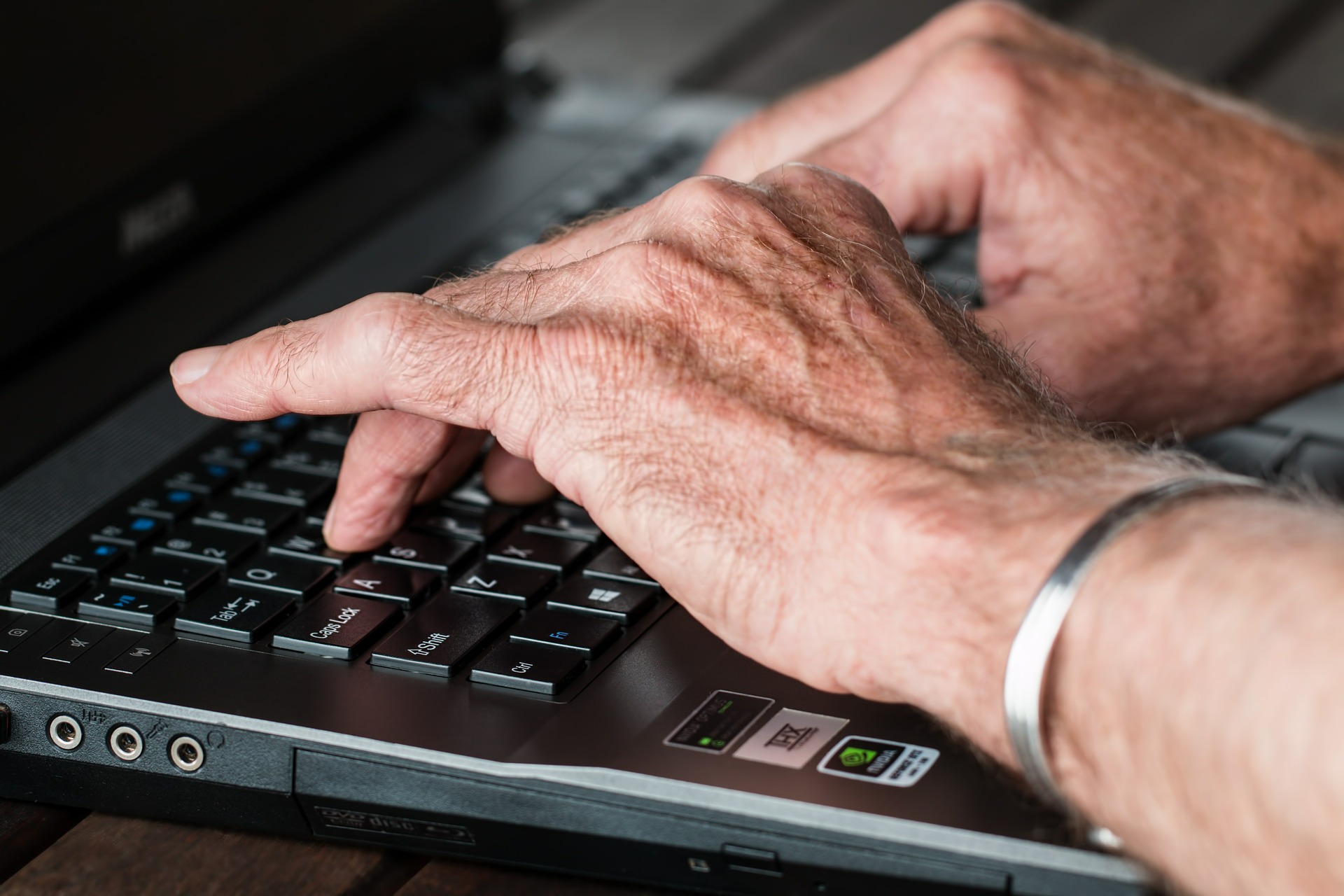 Photo of person using a computer keyboard